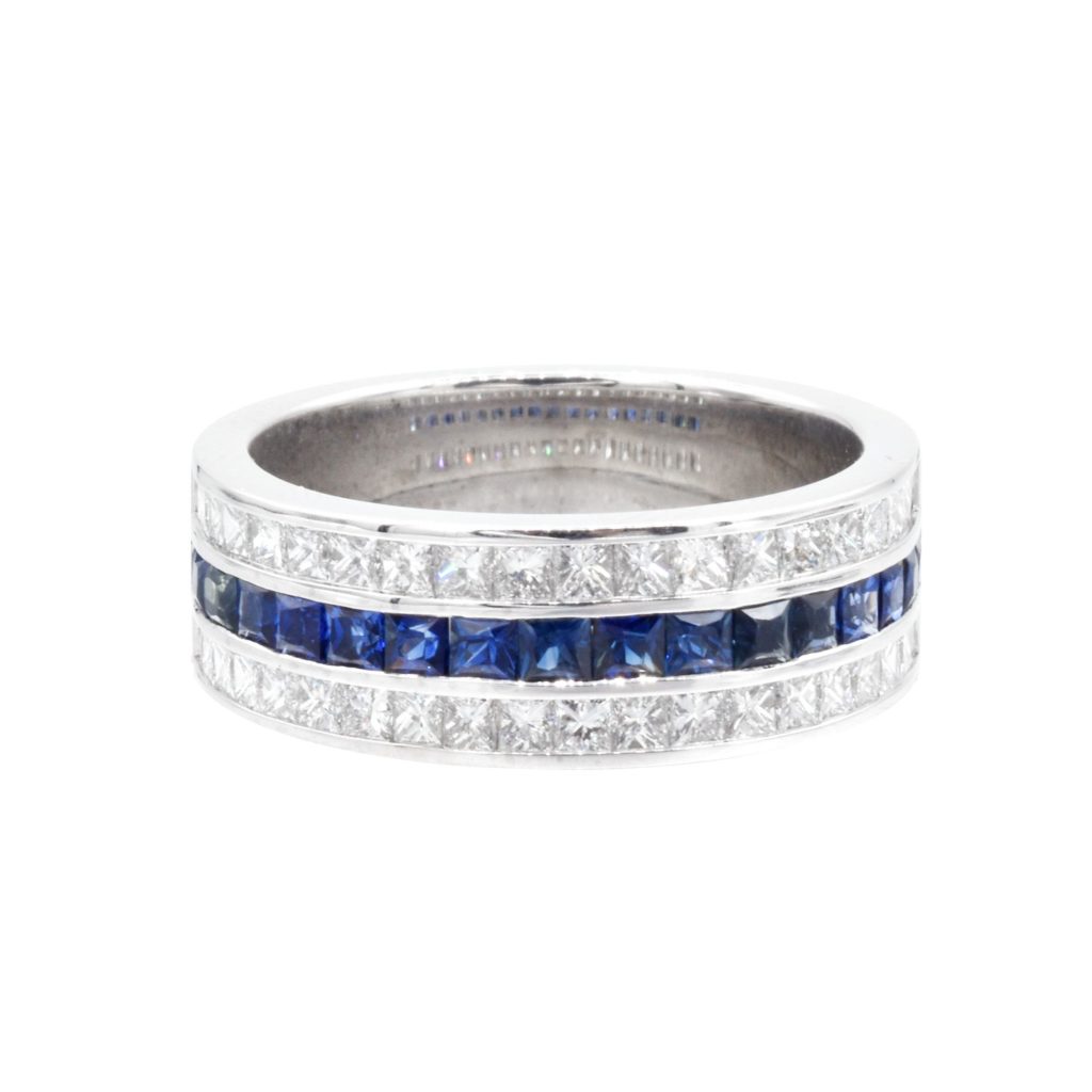 silver and blue ring with gemstones