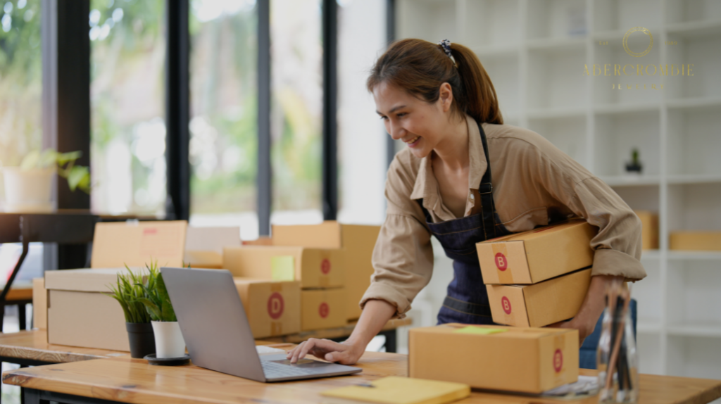 woman holding boxes white using laptop