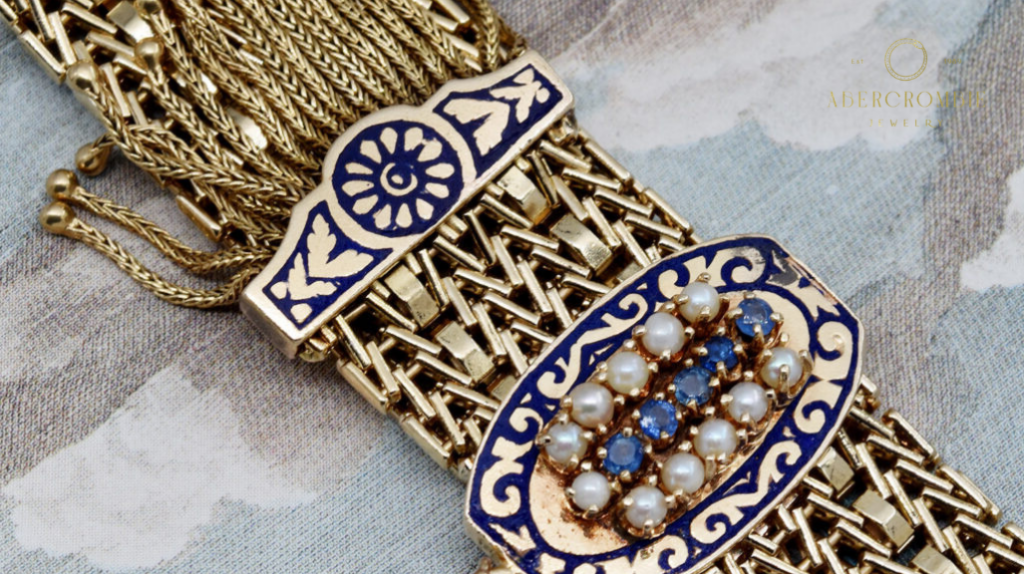 gold jewelry with pearl and blue gemstone