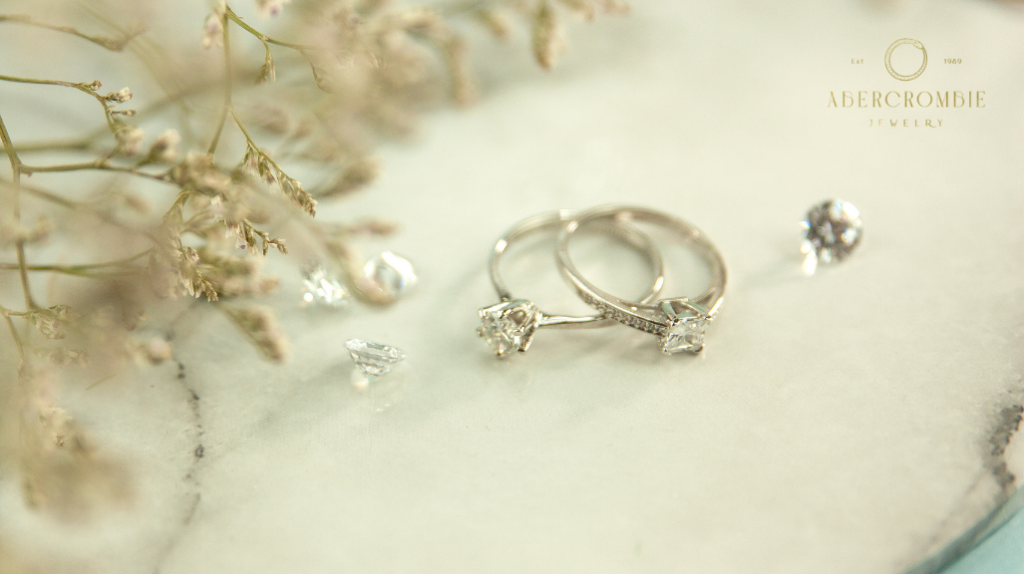two silver-plated diamond studded rings