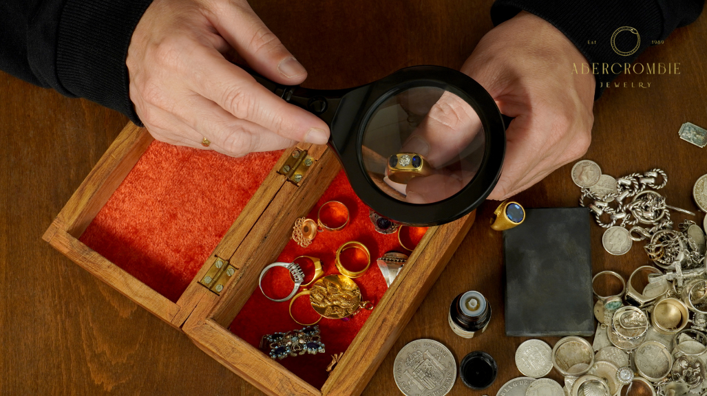 person checking gold plated ring using magnifying glass